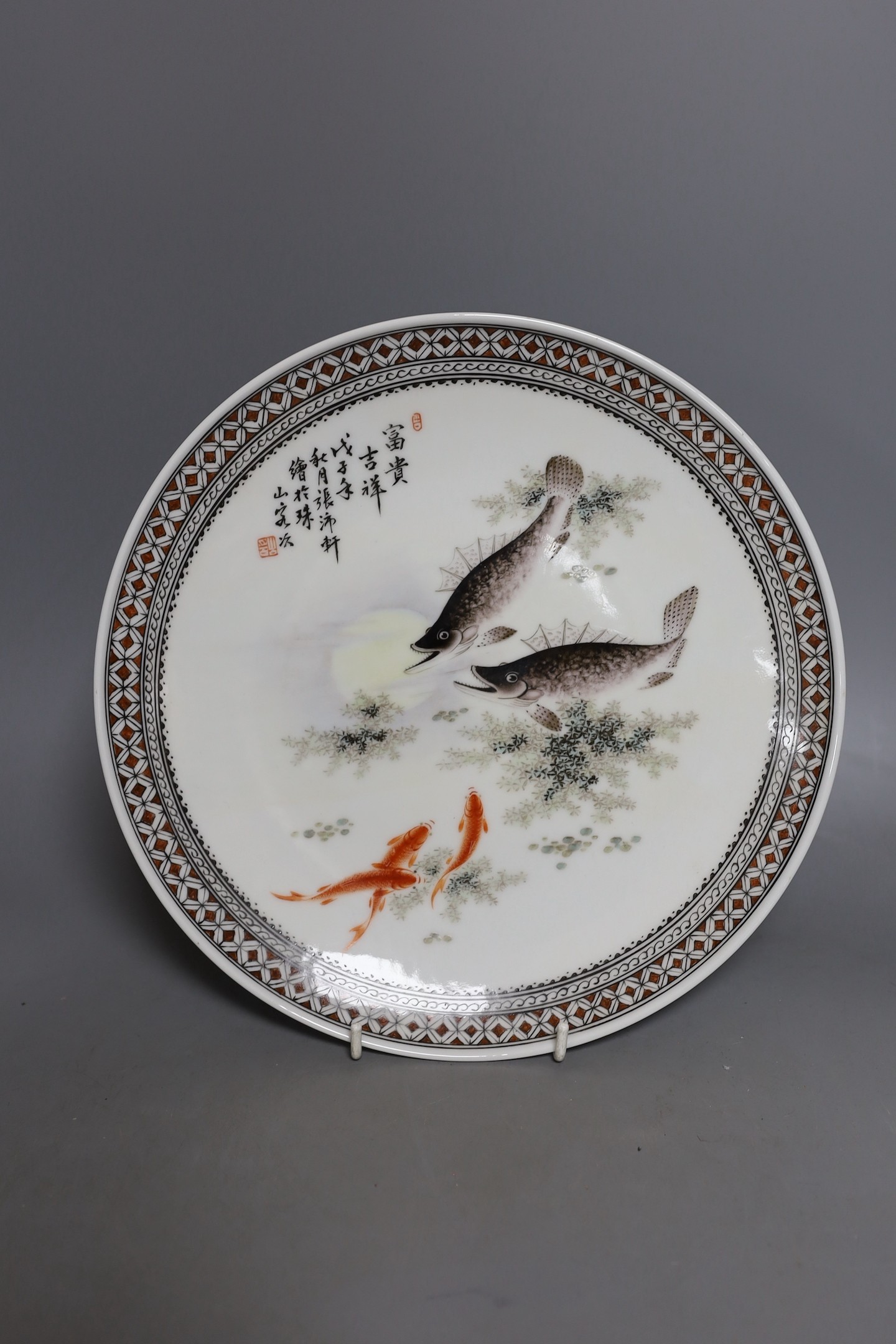 Two Chinese enamelled porcelain dishes, largest 27.5 cms diameter.